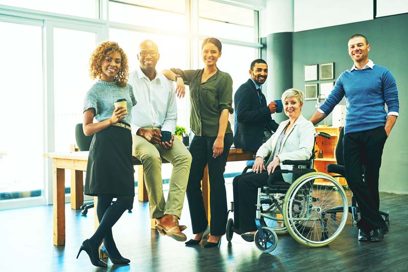 Group of diverse employees posing for a picture